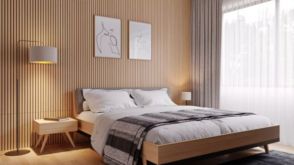 Modern bedroom featuring vertical wood slat wall panels behind a bed